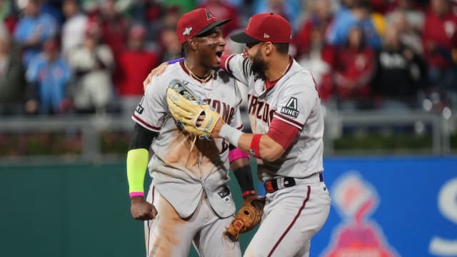 Lourdes Gurriel Jr. Celebrates 4-2 win over Phillies with Geraldo Perdomo in Game 7 of NLCS